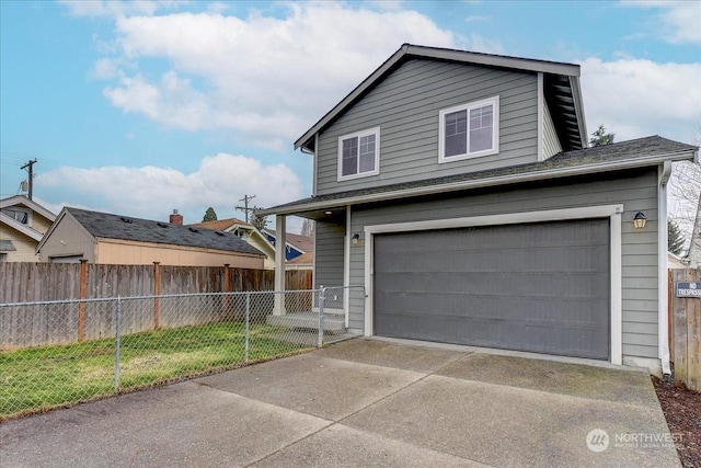 view of front facade with a garage and a front lawn