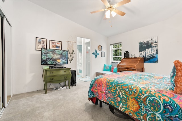 carpeted bedroom featuring ceiling fan and lofted ceiling