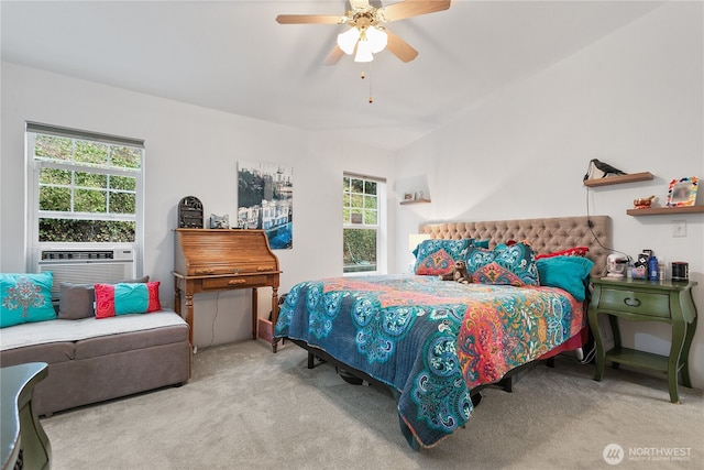 carpeted bedroom featuring ceiling fan and cooling unit