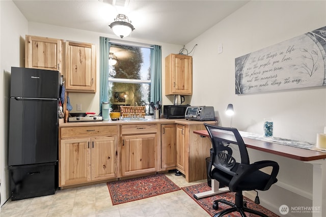 kitchen with black fridge