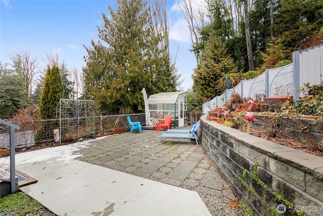 view of patio featuring an outbuilding