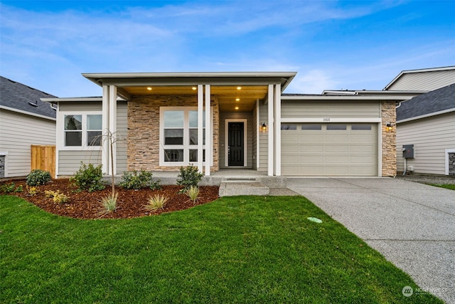 view of front facade with a garage and a front yard