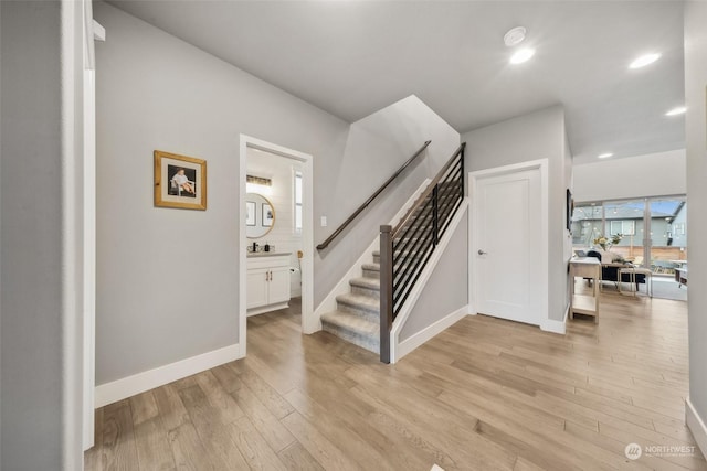 stairway featuring wood-type flooring