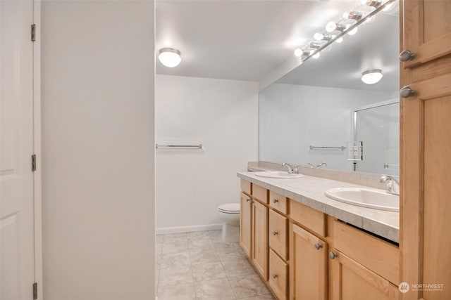 bathroom featuring vanity, toilet, tile patterned flooring, and a shower with door