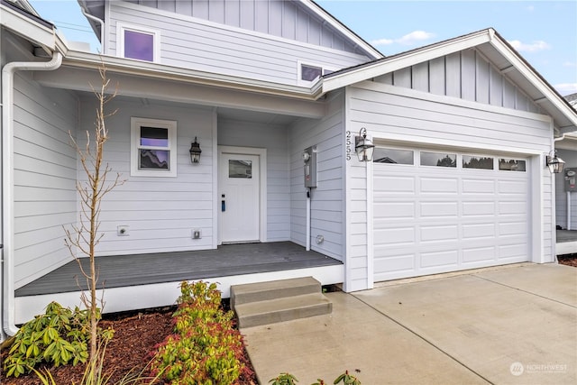 property entrance with a garage and a porch