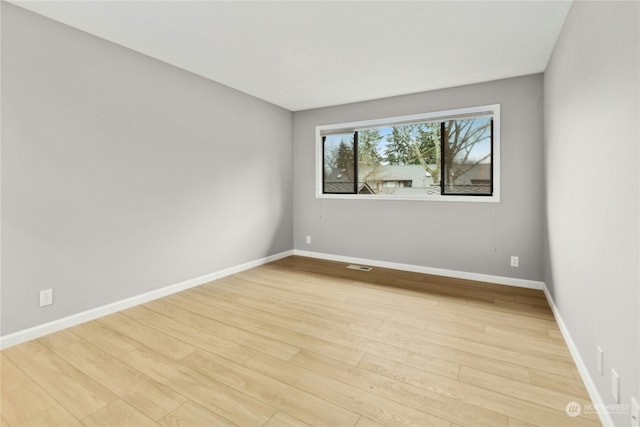 unfurnished room featuring light hardwood / wood-style floors