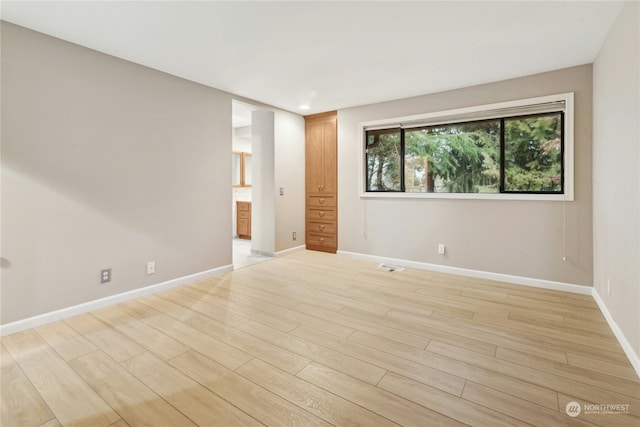 unfurnished room featuring light hardwood / wood-style flooring