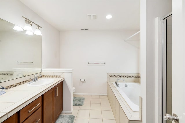 20411 90th Pl S, Kent, WA 98031 - bathroom with tasteful backsplash, tiled bath, tile patterned flooring, vanity, and toilet