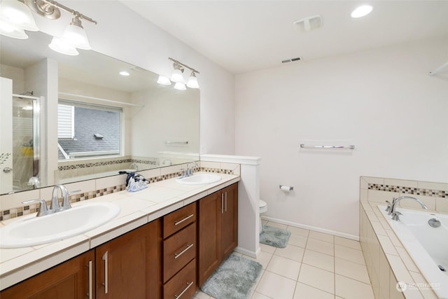 20411 90th Pl S, Kent, WA 98031 - full bathroom with toilet, tasteful backsplash, vanity, plus walk in shower, and tile patterned flooring