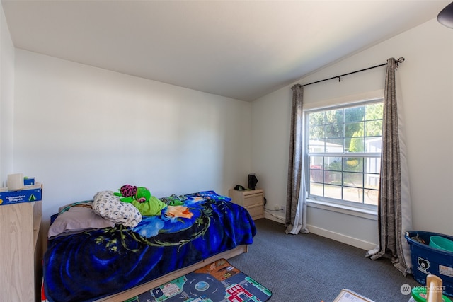 bedroom with lofted ceiling and carpet