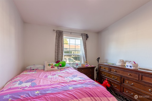 bedroom with lofted ceiling