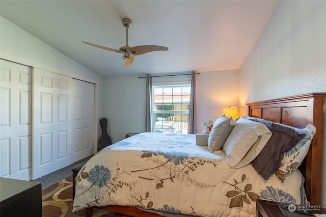 carpeted bedroom with lofted ceiling, ceiling fan, and a closet