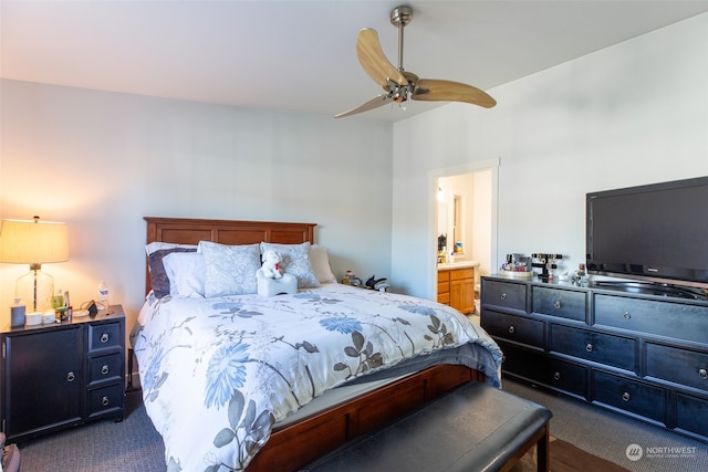 carpeted bedroom with ceiling fan and ensuite bathroom