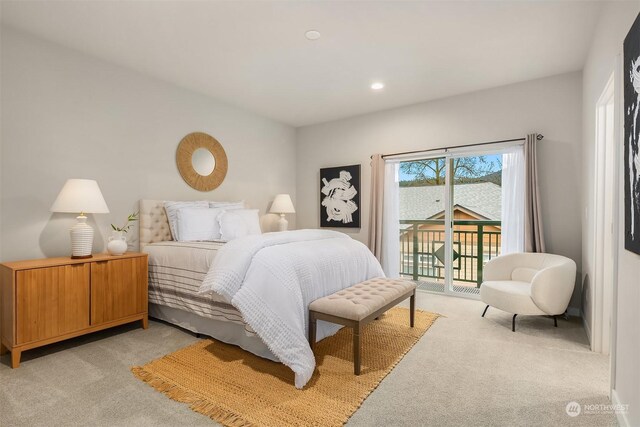 bedroom featuring light carpet and access to outside