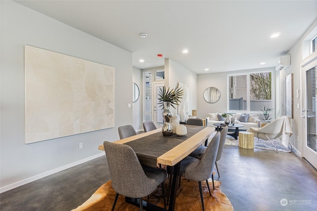 dining space featuring an AC wall unit