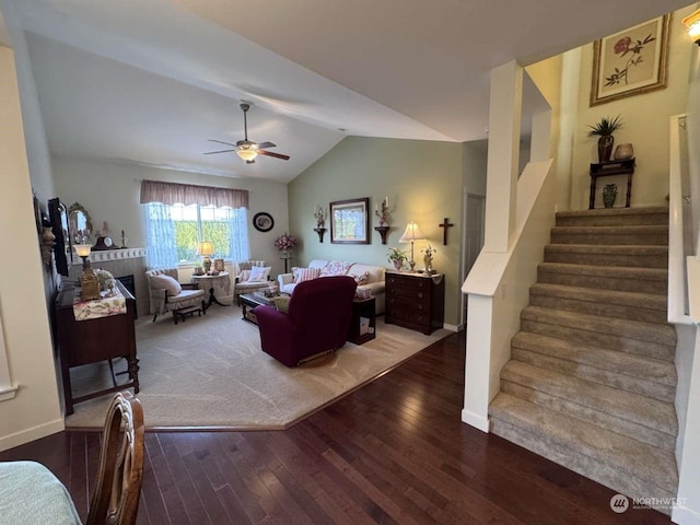 living room featuring hardwood / wood-style flooring, ceiling fan, and lofted ceiling