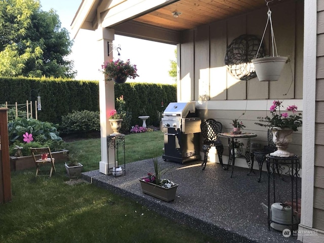 view of patio featuring a grill