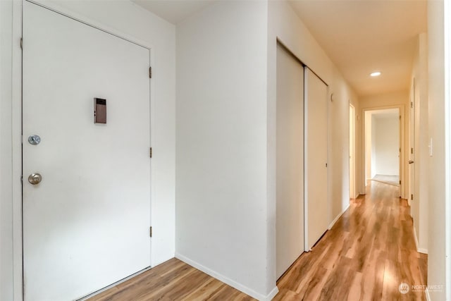 corridor featuring light wood-type flooring