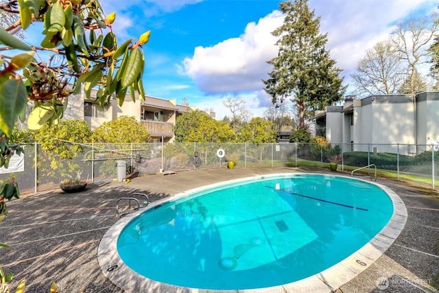 community pool featuring fence