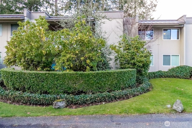 view of home's exterior featuring a lawn