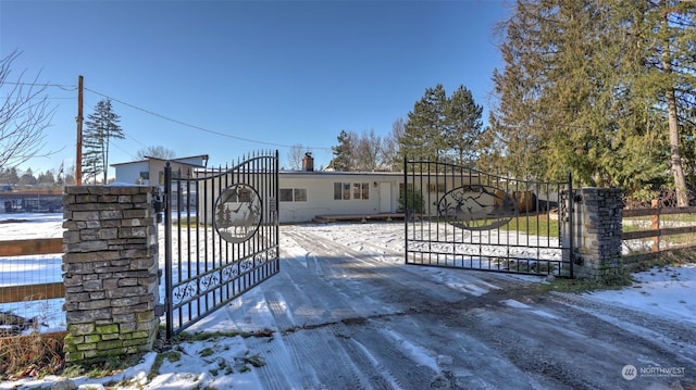 view of snow covered gate