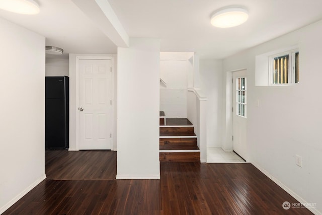 stairs featuring hardwood / wood-style flooring