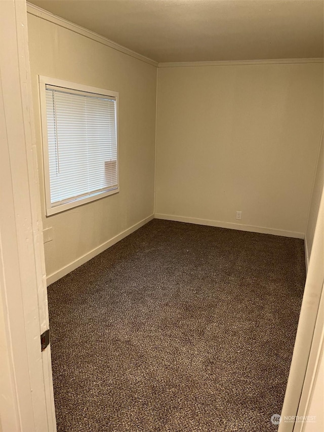 carpeted spare room with crown molding