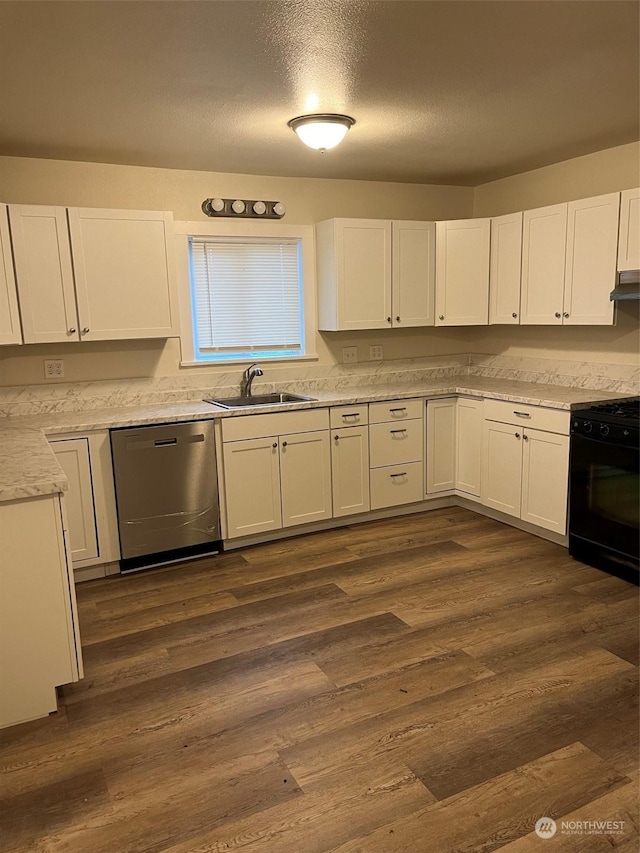 kitchen with sink, dishwasher, stove, white cabinetry, and dark hardwood / wood-style floors