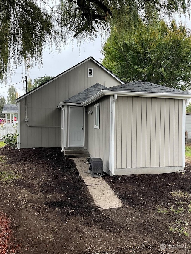 back of property featuring cooling unit