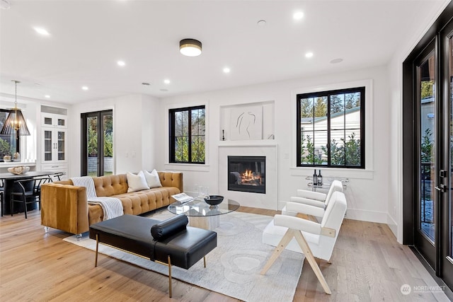 living room with light hardwood / wood-style flooring