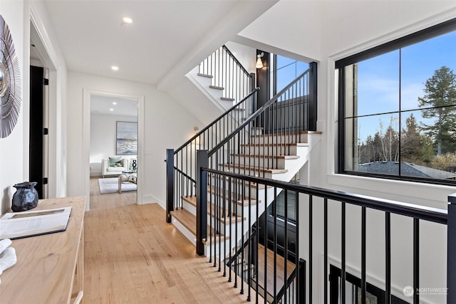 stairway with hardwood / wood-style flooring