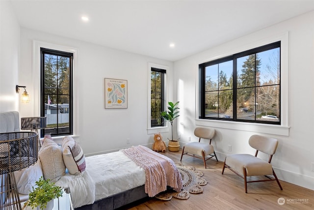 bedroom with hardwood / wood-style floors