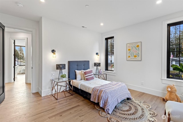 bedroom with light hardwood / wood-style floors