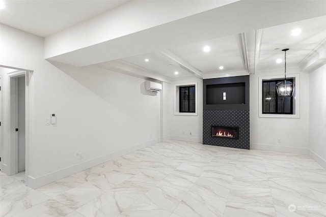 basement featuring a tile fireplace, ornamental molding, and a wall unit AC