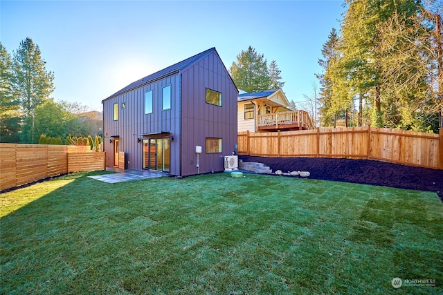 rear view of house with a lawn