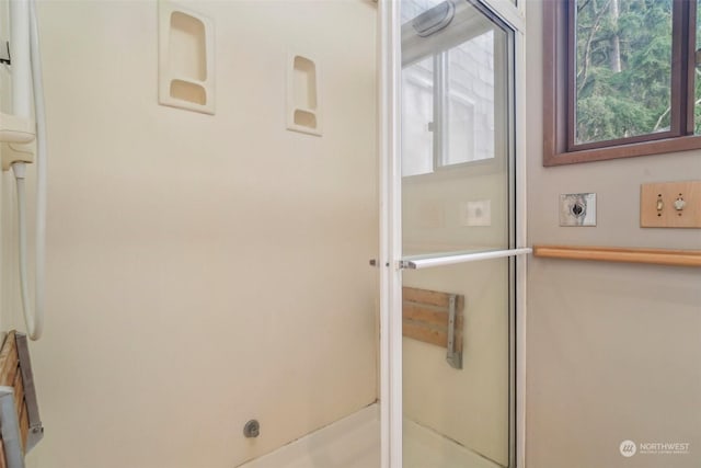 bathroom featuring an enclosed shower