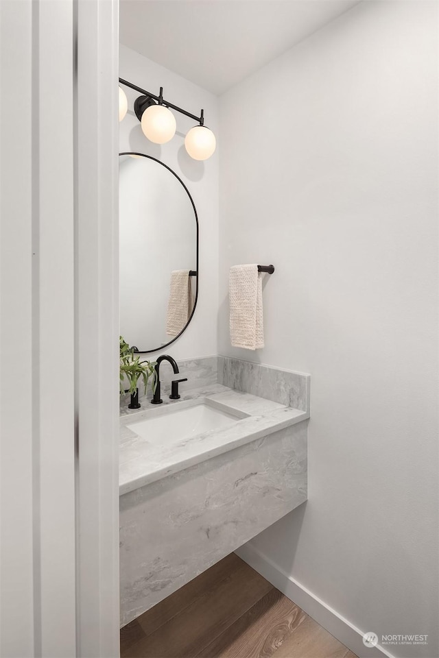 bathroom with wood-type flooring and vanity