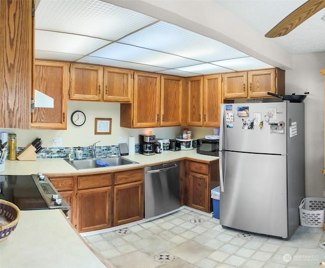 kitchen featuring stainless steel appliances and sink