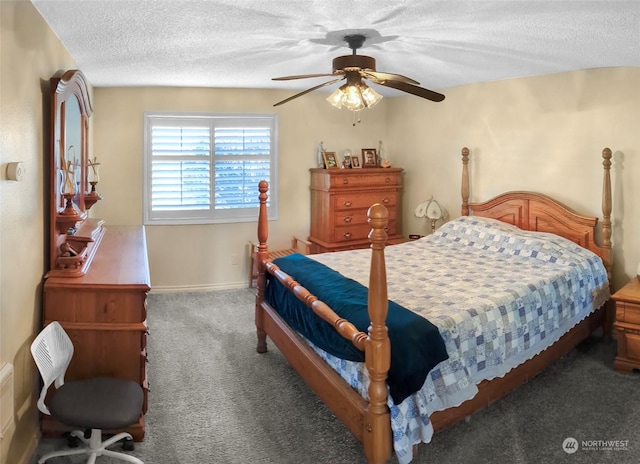 bedroom featuring ceiling fan, dark carpet, and a textured ceiling