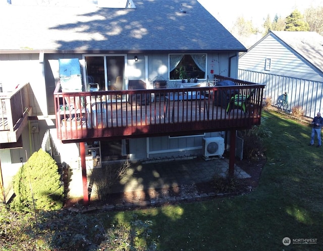 back of house featuring ac unit, a yard, a deck, and a patio area