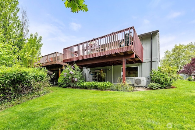 rear view of house with a lawn, a wooden deck, board and batten siding, and ac unit