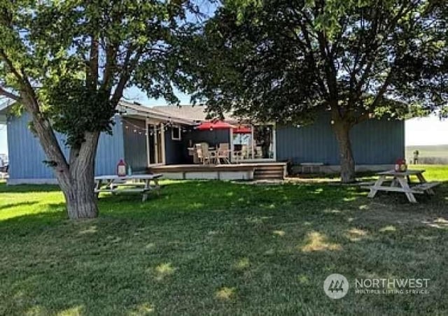 view of yard featuring a wooden deck