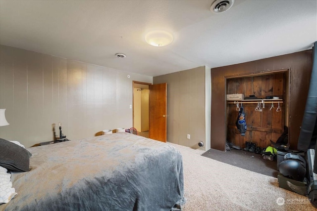 carpeted bedroom with a closet