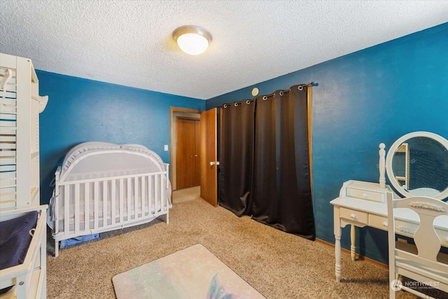 carpeted bedroom with a textured ceiling