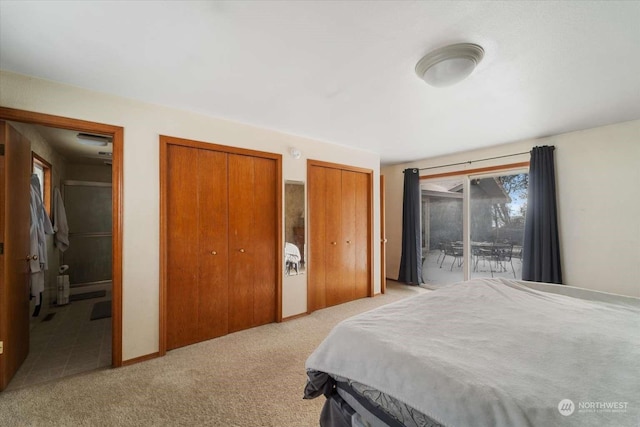 bedroom with multiple closets, light colored carpet, connected bathroom, and access to outside