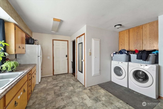 laundry area with sink and washer and dryer