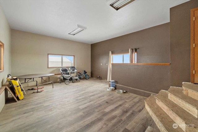 interior space featuring hardwood / wood-style flooring and a healthy amount of sunlight