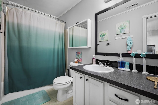 bathroom featuring toilet, vanity, and ornamental molding