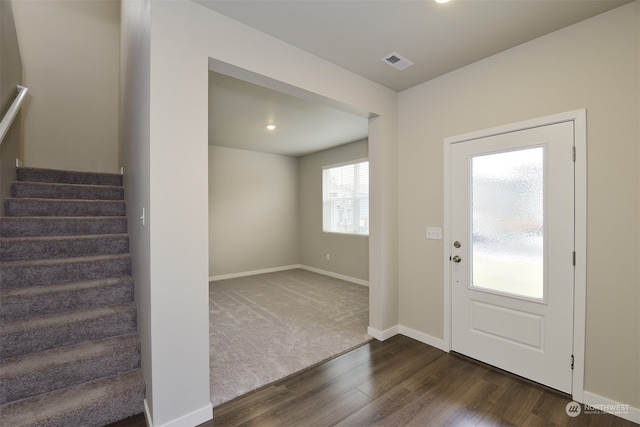 foyer entrance with dark hardwood / wood-style floors