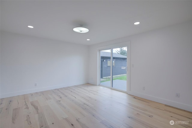 unfurnished room featuring light wood-type flooring